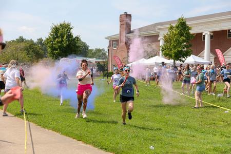 Students race through the color run section of the Residence Life Half K. - Photo by Karley Hathcock