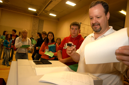 PC Support Manager Michael Hale helps out with registration during the Spring Thing weekend. - Photo by Morris Abernathy
