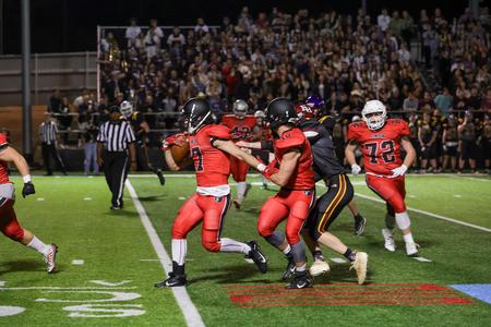 Caleb Pearce runs toward the end zone after intercepting a pass from Freed-Hardeman University in the Buster Bowl. - Photo by Karley Hathcock