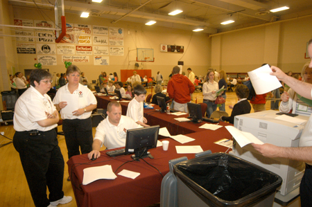Computing Services' Connie Magers, Karen McWherter and Mike Smith support registration during the Spring Thing weekend. - Photo by Morris Abernathy