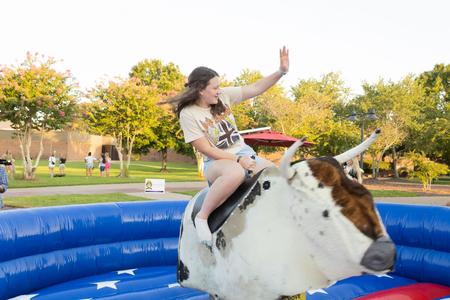 A new Bulldog enjoys a ride at SACFest during Welcome Week. - Photo by Abigail Aspinwall