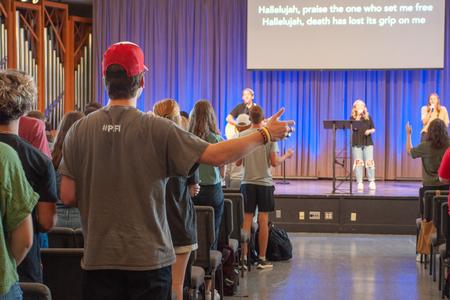 Steve Moore and students from West Jackson Baptist Church lead in worship during a chapel service. - Photo by Lauren Steed
