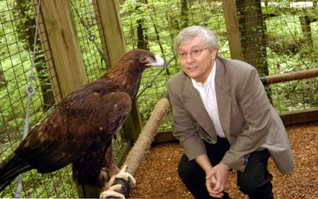 Dr. James Huggins interacts with Aiko, an 18 year old golden eagle, who is housed at Cypress Grove Nature Park. - Photo by Morris Abernathy