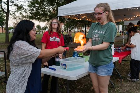 The Union community enjoyed getting to interact with various departments on campus at Union Night during Family Weekend. Here a student gets a chance to interactive with the Chemistry student organization, SMACS. - Photo by Lauren Steed