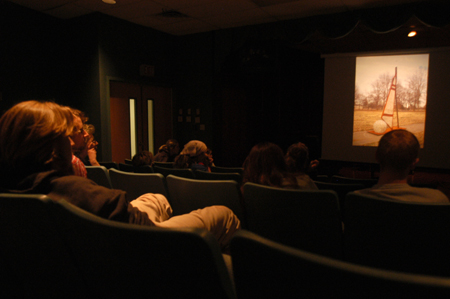 Rob Alsobrook, senior art major, shows slides of his sculptures during the Scholarship Symposium. Alsobrook spoke about the challenges faced by Christian artists. - Photo by Kristen Nicole Sayres