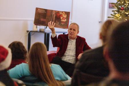 President Oliver reads The Night Before Christmas to Union students during Christmas with the Olivers in the McAfee Commons. - Photo by Lindsey Atwood