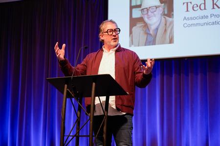 Ted Kluck, associate professor of communication arts, speaks to students during the Faculty Member of the Year chapel service. - Photo by Lauren Steed
