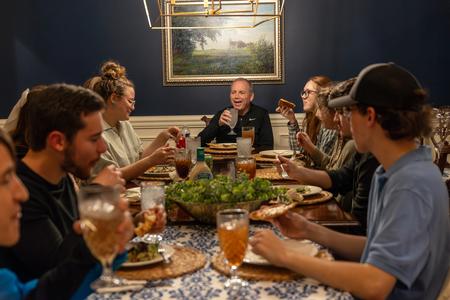 President Oliver hosts a group of students for dinner at his home as a part of SAC's Be Our Guest. - Photo by Karley Hathcock
