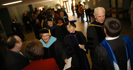Faculty members congratulate Cindy Meredith and Chris Hail after they were named Staff and Faculty Members of the Year, respectively. - Photo by Morris Abernathy