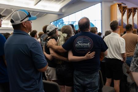 An incoming freshman and her parents worship together during Welcome Week's Blessings Chapel. - Photo by Karley Hathcock