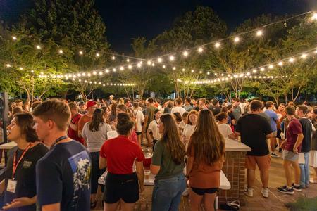 The Class of 2028 gathers for a refreshment break around the PAC fountain during Welcome Week. - Photo by Karley Hathcock
