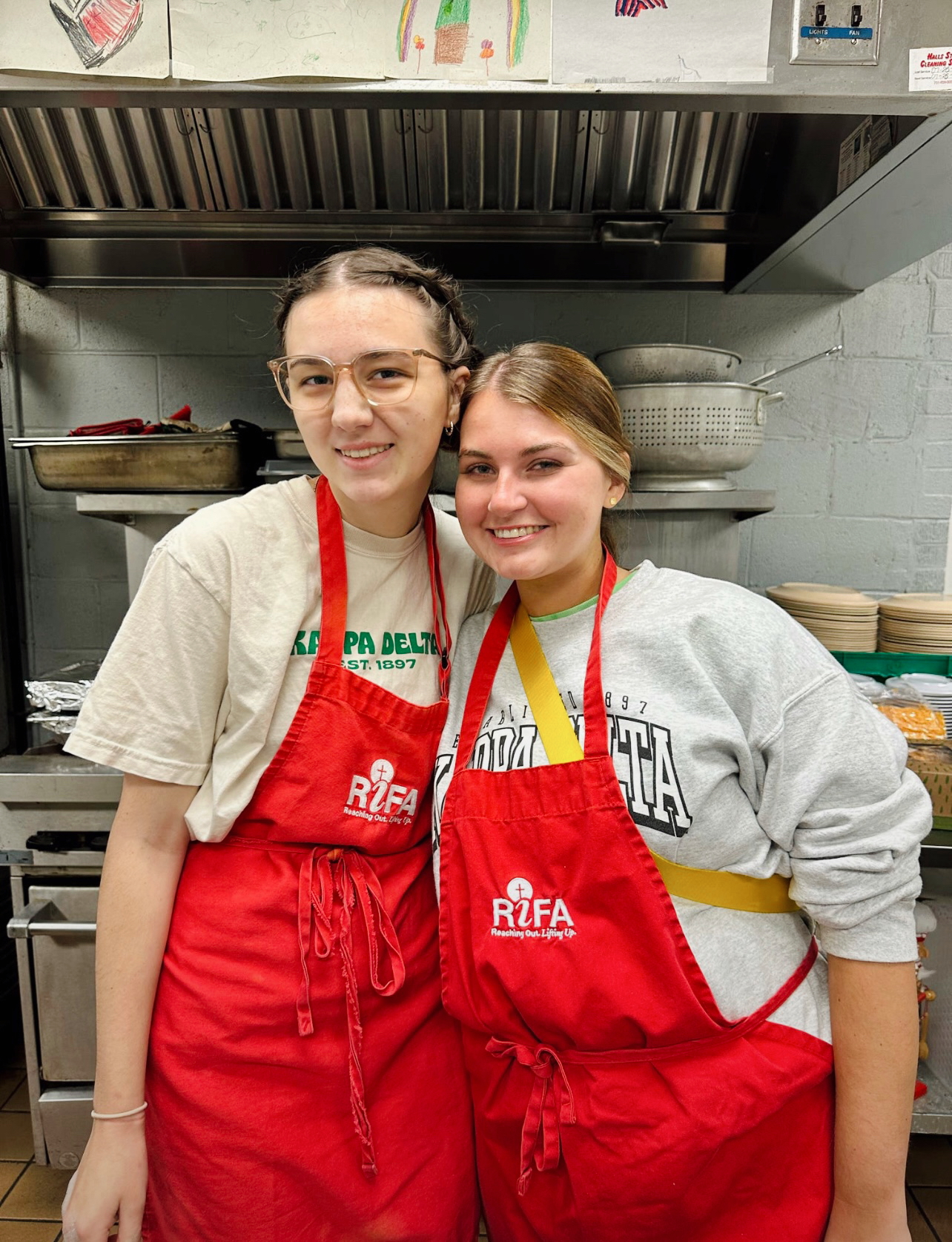 10/22/24 - Members of Kappa Delta chop vegetables and help prepare meals in the soup kitchen at RIFA for Campus and Community Day held during Homecoming Week. - Karley Hathcock