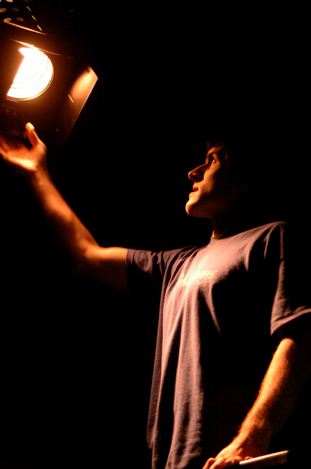 Senior Patrick Myers works on the lighting for the theatre's production of <i>Shadowlands</i>. - Photo by Lindsay Stavish