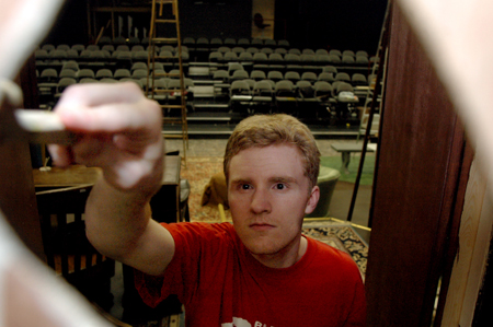 Junior Andy Morris works on the set of the theatre's production of <i>Shadowlands</i>. - Photo by Lindsay Stavish