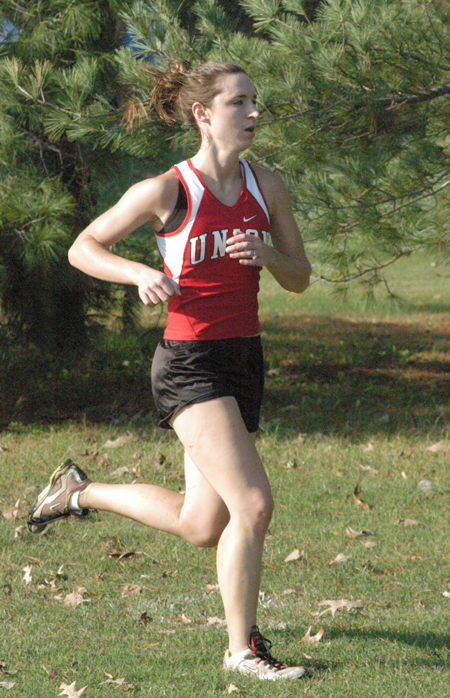 Janelle Royer Campbell runs in the 2004 TranSouth Conference Cross Country Meet.  Campbell took first place in this event and was named the Conference Runenr of the Year. - Photo by Steven Aldridge