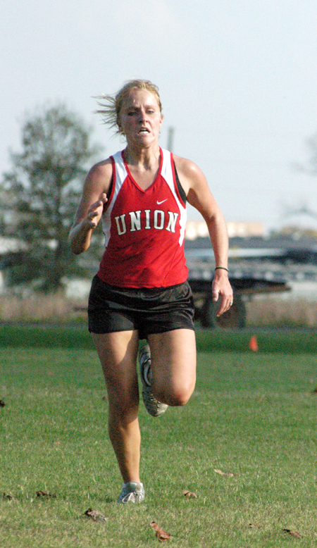 Ruth Schroeder approaches the finish line in the 2004 TranSouth Cross Country Meet.  Union took first place in the event with Schroeder taking second place in the individual. - Photo by Steven Aldridge