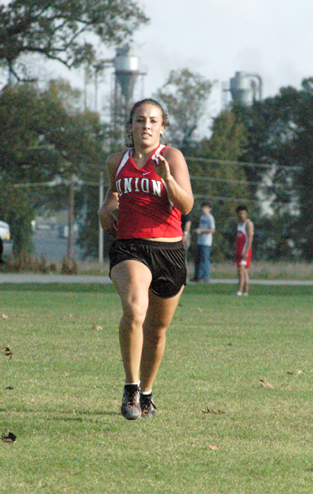 Freshman runner Candace Cross takes third in the 2004 TranSouth Cross Country Meet and was named the Freshman Runner of the Year in the conference. - Photo by Steven Aldridge