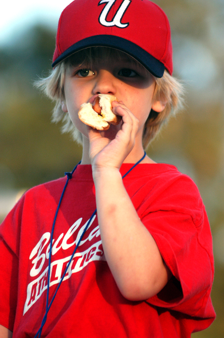 A future Union Bulldog enjoys a hotdog during lunch at Union's Baseball Camp. - Photo by Kristen Nicole Sayres