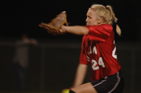 Junior pitcher Mary Kosco (24) in the middle of making a pitch. - Photo by Jonathan Blair
