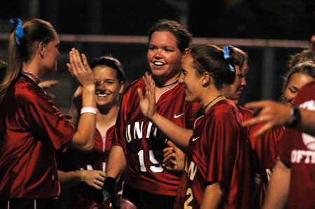 Danielle Pope (15) is congratulated by her teammates after one of her record setting homeruns.  Pope set a new homerun mark for Union with 14 in 2005. - Photo by Jonathan Blair