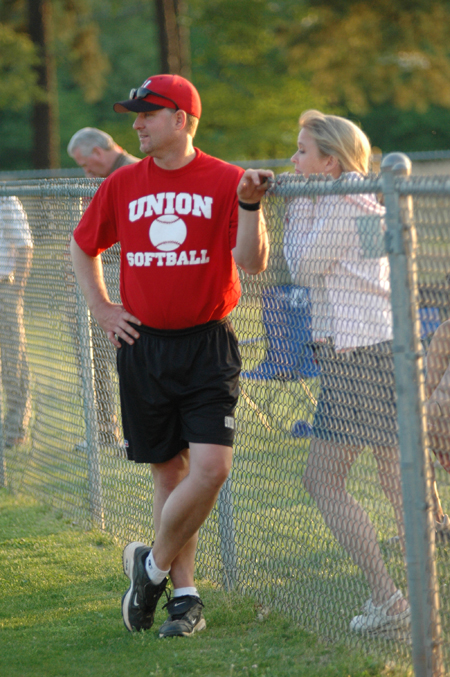 Head Coach Brian Dunn, in his final season at Union after his resignation, talks with his wife Emily prior to the start of a game. - Photo by Jonathan Blair
