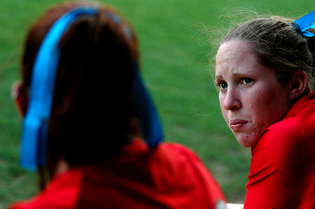 Kylie Sullivan (right) talks with Chrissa Norton in the dugout during a Union softball game. - Photo by Jonathan Blair