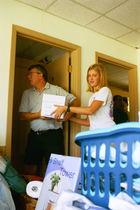 Freshman Emily Boecking moves in during Freshman Move-In with help from her father Mike Boecking. - Photo by Kristen Hiller