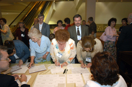 Union University friends and alumni sign in at the dessert reception June 21 during the Southern Baptist Convention. - Photo by Morris Abernathy