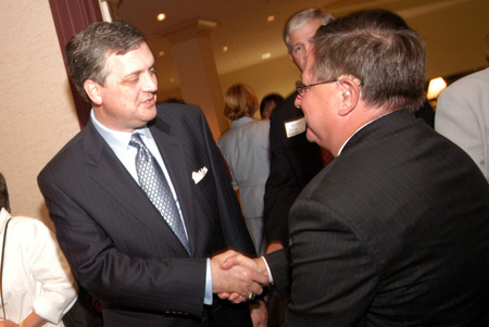 Gary Williams (right), associate vice president for university relations, welcomes R. Albert Mohler Jr., president of Southern Baptist Theological Seminary, to Union's dessert reception during the Southern Baptist Convention. - Photo by Morris Abernathy