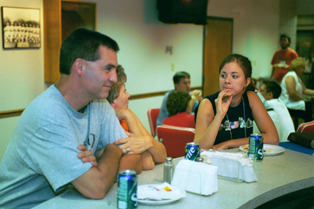 Freshman Music major Ashley Goodin enjoys her last meal with her parents for a while. - Photo by Amanda Smith