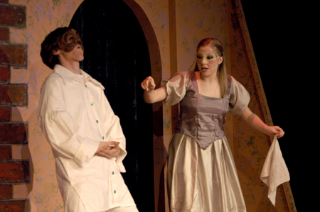 Sophomore Josh Wilkinson tells Freshman Jill Casey of his hunger in <i>The Battle of Dim Wits</i>. - Photo by Kristen Nicole Sayres