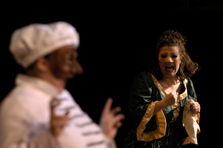 Senior Ashley Mitchell gasps in terror as Lindsey Young's character declares his love for her in <i>The Battle of Dim Wits</i>. - Photo by Kristen Nicole Sayres