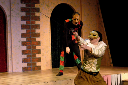 Freshman Carson Turner stands amazed at Junior Courtney Braswell's swordsmanship in <i>The Battle of Dim Wits</i>. - Photo by Kristen Nicole Sayres