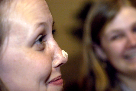Senior Jessica Rudy gets some whip cream on her nose while Freshman Stephanie Scofield looks on.  The students had setup an impromptu coffee bar in McAfee during finals. - Photo by Jonathan Blair