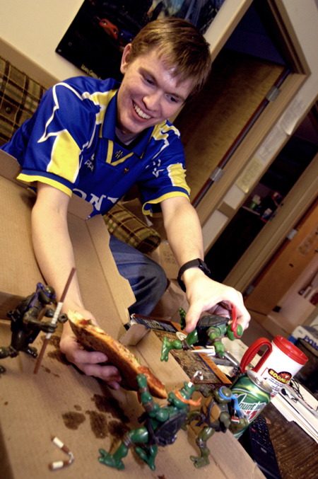 Senior Adam Winters plays with his food during finals week. - Photo by Jonathan Blair