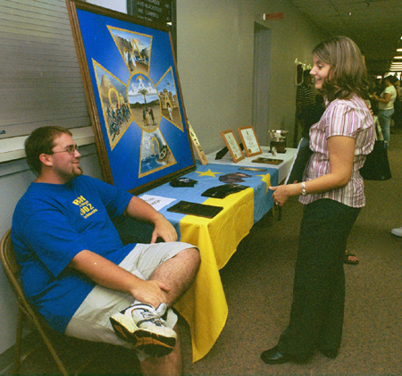 ATO Josh Lefler mans the booth for his fraternity at the Campus Life Fair during New Student Orientation. - Photo by Kristen Hiller