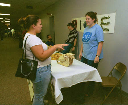 BIOME members take the opportunity to inform a new student about their work at the Campus Life Fair during New Student Orientation. - Photo by Kristen Hiller
