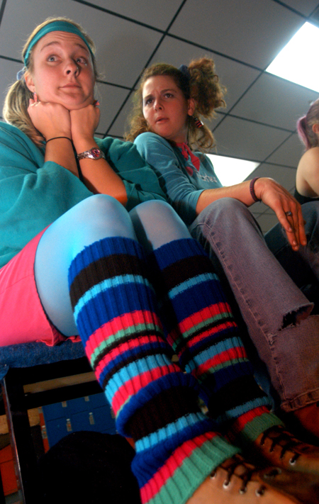 Senior Kristin Veach & Freshman Casey Rentfro prepare to hit the floor during 80s Skate Night. - Photo by Jonathan Blair