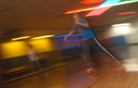 Freshman Drew Winter streaks down the floor during 80s Skate Night. - Photo by Jonathan Blair