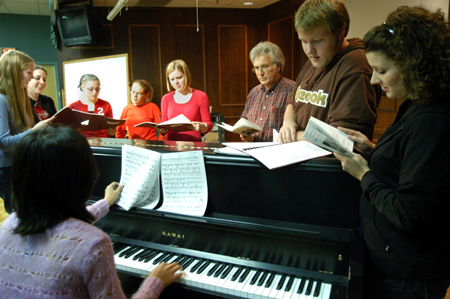 David Burke and the cast rehearse for <i>Alexander and the Terrible, Horrible, No Good, Very Bad Day</i>, which was presented by the Union University Players Nov. 15-18. Pictured from left to right: Katie Mathis, Catherine Schulz, Jill Casey, Julie Palmer, Courtney Braswell, David Burke, Jared Pengra, and Ashley Mitchell. - Photo by Kristen Hiller