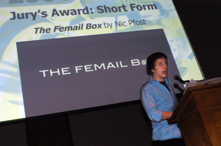DMS major Nic Pfost accepts the Jury's Award for Short Form Film for his animated piece <i>The Femail Box</i> during the 2004 Student Film Festival. - Photo by Kristen Nicole Sayres