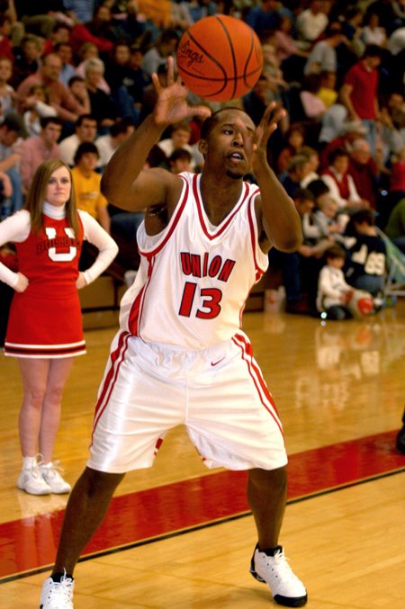 Courtney Jones receives a pass as he squares up behind the three-point line.
 - Photo by Jonathan Blair