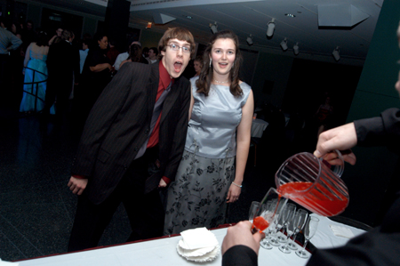 Seniors Kevin Minister and Meredith Williams go for some punch during the Cardinal Ball at the Brooks Museum of Art in Memphis. - Photo by Jonathan Blair