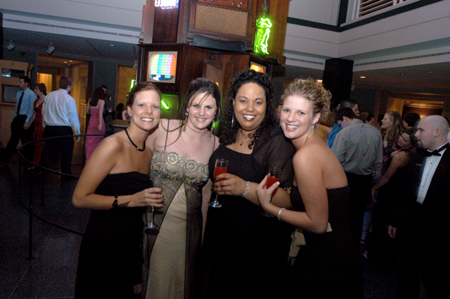 Sophomore E. J. Dufford, Freshman Meggan Prince, and Sophomores Lauren Washington and Ashley Abernathy pose for a group picture during the Cardinal Ball at the Brooks Museum of Art in Memphis. - Photo by Jonathan Blair