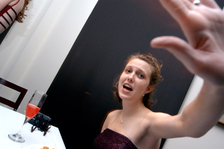 Senior Jessica Rudy tries to avoid the camera during the Cardinal Ball at the Brooks Museum of Art in Memphis. - Photo by Jonathan Blair