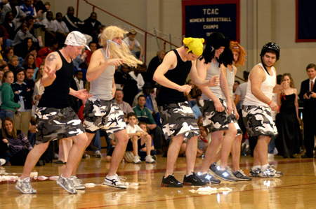 Freshmen Lee Lattier, David Holsinger, Duncan Nicol, Phillip Mitchell, and Sophomores Luke Self, Daniel Freeman perform a special dance for the Homecoming crowd. - Photo by Kristen Nicole Sayres