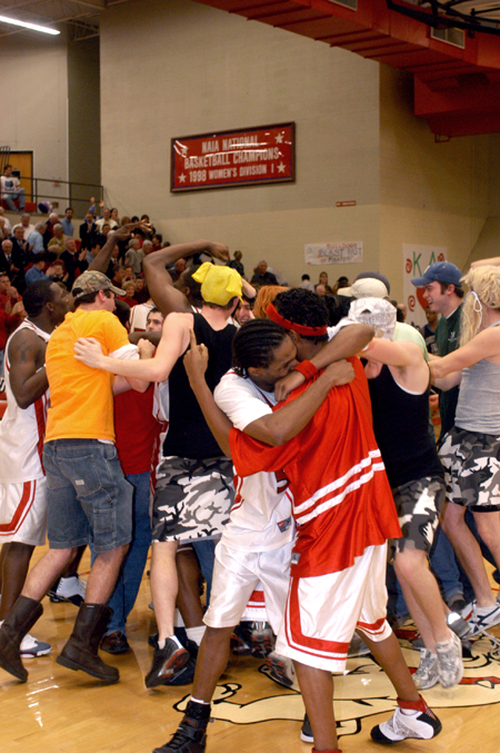 Union players and fans rush the court after the Bulldogs took down Mountain State College (NAIA #1) during Homecoming.
 - Photo by Kristen Nicole Sayres