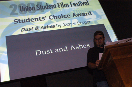 History major James Berger accepts the Students' Choice Award for his film <i>Dust and Ashes</i> during the 2004 Student Film Festival. - Photo by Kristen Nicole Sayres