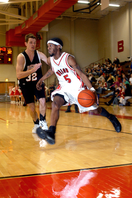 Marcus Cooper drives towards the basket against a Georgetown defender. - Photo by Kristen Nicole Sayres