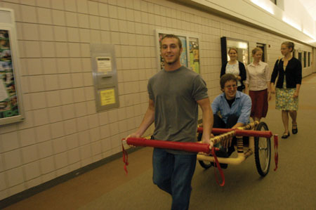 Arriving in style, junior filmmaker Nic Pfost is led into the 2004 Student Film Festival by chariot, driven by the brawny DMS junior Matt Brubaker. - Photo by Kristen Nicole Sayres